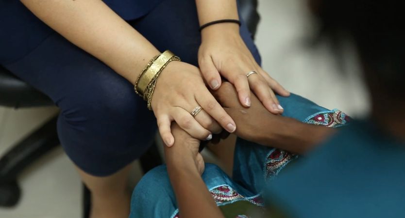 Hands holding each other
