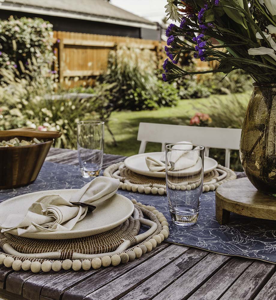 Table setting with neutral woven placemats and napkins